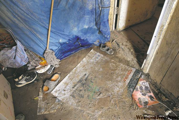 Filthy floors and rotting walls are grim reality for the 13 people who call  Richard  Andrews' rundown trailer home.