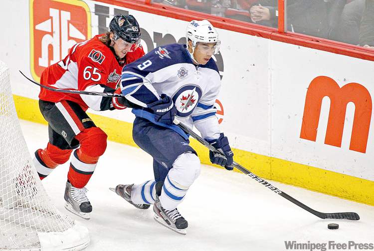 REUTERS
Blair Gable / reuters
Ottawa Senators� Erik Karlsson makes contact with Winnipeg Jets forward Evander Kane during the first period of their NHL game in Ottawa Thursday.