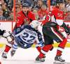 Postmedia Ottawa Citizen
Jean Levac / postmedia news
 Jets forward Chris Thorburn gets dumped to the ice by Ottawa blue-liner Jared Cowen during the second period at Scotiabank Place Thursday.