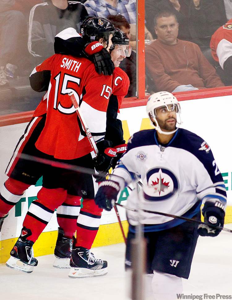 Blair Gable / reuters
Jets blue-liner Johnny Oduya watches the replay after Ottawa's Daniel Alfredsson intercepted his pass and scored.