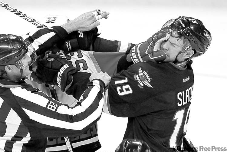 JOHN WOODS
John Woods/Winnipeg Free Press
Jets� centre Jim Slater (right) took a knee to the head last game against Carolina and also mixed it up with Jeff Skinner. He�s questionable for tonight�s contest.