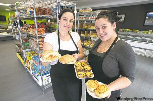MIKE DEAL / WINNIPEG FREE PRESS
Viena do Castelo owner Ana Godinho Esteves (left) and manager Beta Godinho with an array of baked goods.