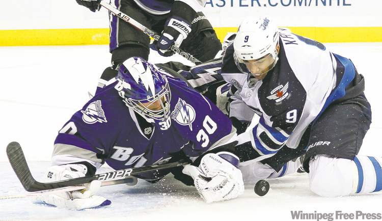 CP
Chris O�Meara / the associated press
Tampa Bay goalie Dwayne Roloson was perfect Saturday night. Here he stymies Jets left-winger Evander Kane in the first period.
