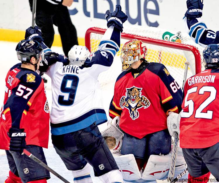 CP
alan diaz / the associated press
Winnipeg Jets winger Evander Kane celebrates after scoring the tying goal, 3-3, against Florida Panthers goalie Jose Theodore Monday night.