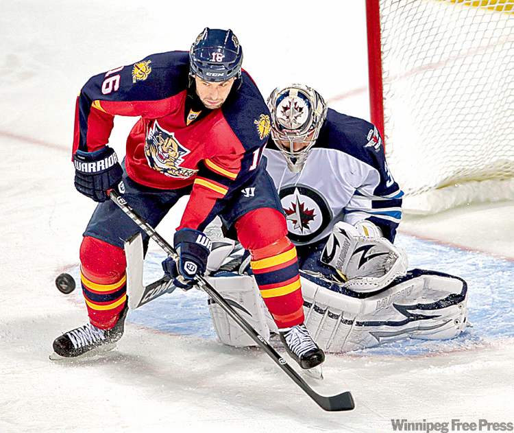 CP
alan diaz / the associated press
Jets goalie Ondrej Pavelec stymies Florida Panthers� Marco Sturm.