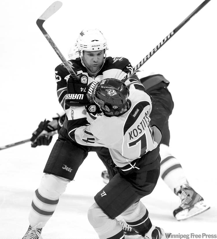 TREVOR HAGAN / WINNIPEG FREE PRESS archives
Mark Stuart�s gritty, take-no-prisoners style of play means he could be banged up more than once or twice this season.