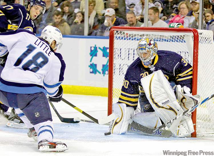 CP
David Duprey / the associated press
Ryan Miller makes a save on this shot by Jets� Bryan Little, but the Winnipeg forward did get two by the Sabres goalie during game in Buffalo Tuesday night.