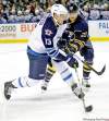 CP
David Duprey / the associated press
Winnipeg�s Kyle Wellwood (left) unloads a shot under pressure from Buffalo�s Ville Leino on Tuesday.