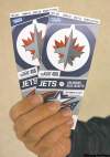 Mike Aporius / Winnipeg Free Press Archives
Hand holding a pair of Winnipeg Jets tickets. 110916 - Friday, Sept. 16, 2011 (Mike Aporius / Winnipeg Free Press)