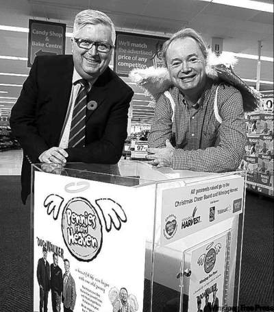 KEN GIGLIOTTI /  WINNIPEG FREE PRESS
A winged Kevin Rollason (right) with Walmart's  Gerry Gerrits. The city's stores are one place you can donate.
