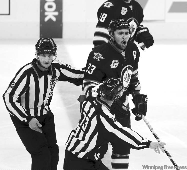 BORIS MINKEVICH / WINNIPEG FREE PRESS archives
Jets defenceman Dustin Byfuglien doesn't like the call, but he's going to the box in any case. Big Buff leads the team with 32 penalty minutes.