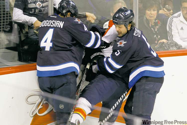 WINNIPEG FREE PRESS
Mark Stuart thinks the game well enough to work with Byfuglien in this regard and appears ready for a larger leadership role.