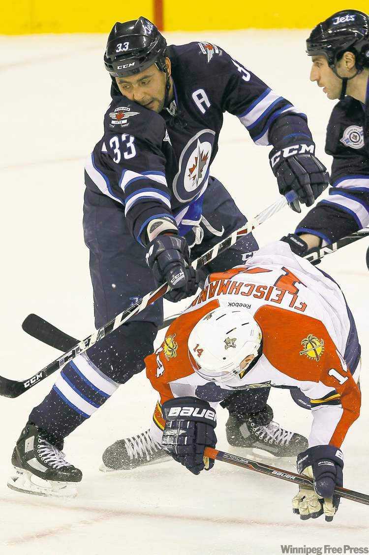 WINNIPEG FREE PRESS
Dustin Byfuglien's ice time has been trimmed back and he rarely takes part in
the penalty kill. Not the trademarks of a team's No. 1 defenceman.