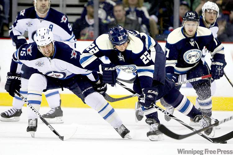 CP
Terry Gilliam / the associated press
Blue Jacket Vinny Prospal (22) controls the puck as Tanner Glass pursues.