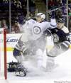 CP
Terry Gilliam / the associated press
Jets� Evander Kane is sandwiched by Columbus Blue Jackets� goalie Steve Mason and Grant Clitsome.