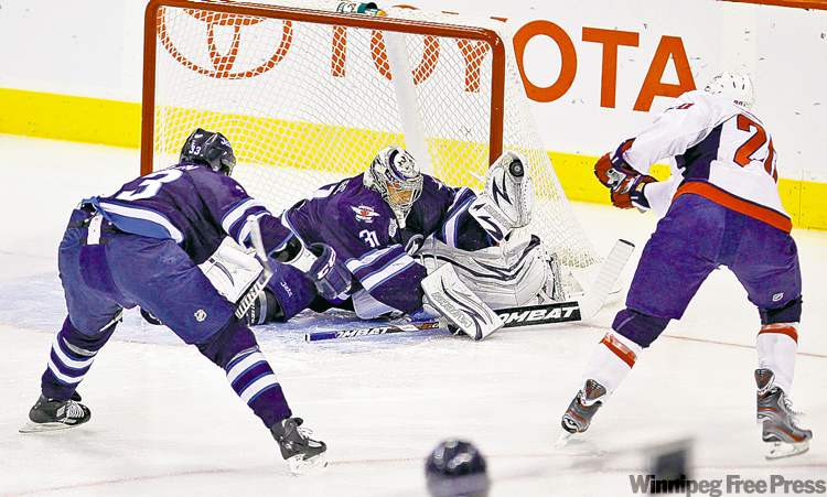 CP
trevor hagan / the canadian press
Ondrej Pavelec stoned the high-flying Capitals offence every time it counted.