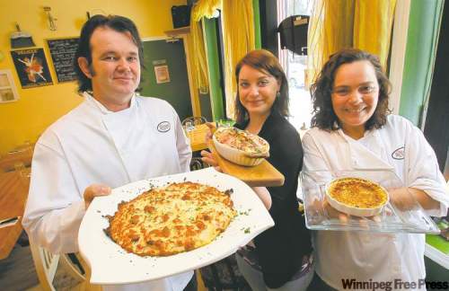BORIS MINKEVICH / WINNIPEG FREE PRESS
Chef and owner Stephane Wild, head waitress Caroline Rousseau and sous chef Lisa Chevrefils with some of the delightful items on Chez Sophie's menu.
