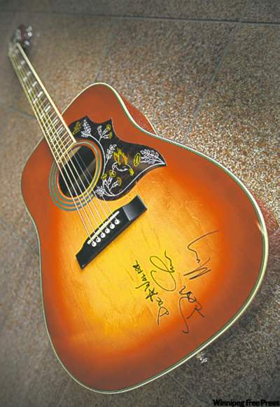 John Woods / Winnipeg Free Press
Someone will win this guitar autographed by the members of Doc Walker.