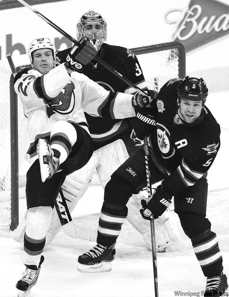 CP
John Woods / the canadian press
When not scoring goals, Jets defenceman Mark Stuart (5) can usually be found in his own end of the rink, helping out his goalie.
