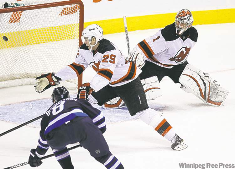 TREVOR HAGAN / WINNIPEG FREE PRESS
Alexander Burmistrov puts a short-handed goal into an empty Devils net.