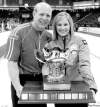 CP
michael burns / the canadian pressSkips Kevin Martin and Jennifer Jones hold the Capital One Canada Cup trophy after winning their respective championships Sunday and qualifying for the 2013 Olympic Trials in Winnipeg.