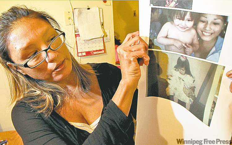 Phil Hossack / Winnipeg Free Press
Adeline Nippi shows photos of daughter Dominique McCann which she gathers for the memorial service.