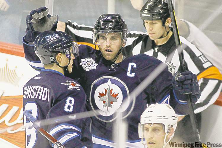 WINNIPEG FREE PRESS
John Woods / WINNIPEG FREE PRESS
Winnipeg Jets captain Andrew Ladd celebrates his goal in the first period.