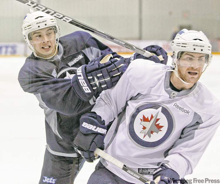 Tim Stapleton (left) and Jim Slater didn�t take the easy way out at Wednesday�s practice. The team went at it hard.