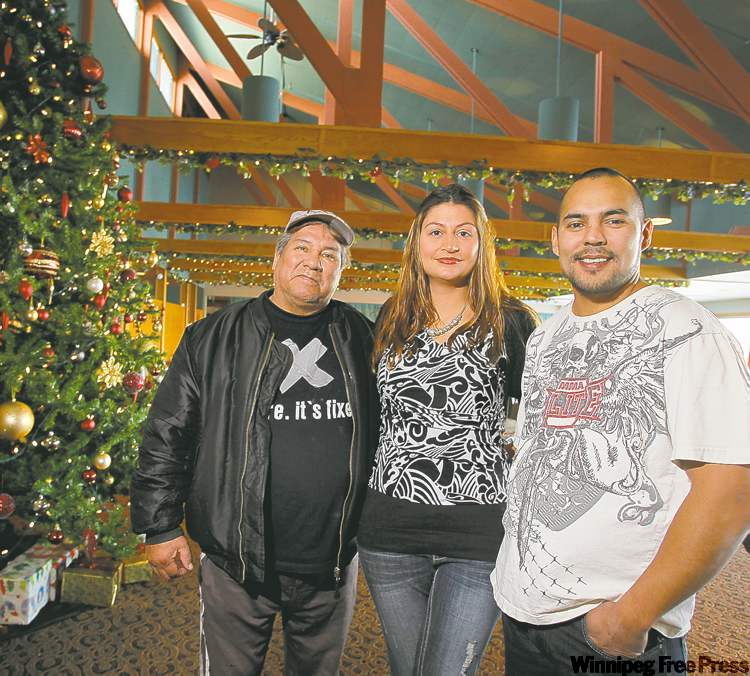 photos by BORIS MINKEVICH / WINNIPEG FREE PRESS
Evacuees George Anderson (left) and Randy Anderson with Misty Lake Lodge manager Retha Dykes.