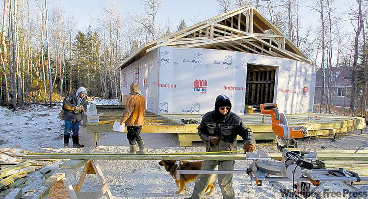 Winnipeg Free Press
Evacuees learn construction skills as they build cottages.