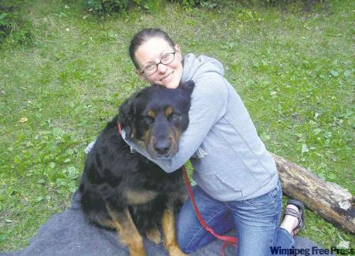supplied photo
Angus steadfastly endures the attentions of owner Ashley on camping trip at Clear Lake in Riding Mountain National Park.