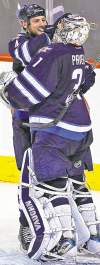 CP
Winnipeg Jets goalie Ondrej Pavelec (31) and Zach Bogosian (4) celebrate a win over the Pittsburgh Penguins at the MTS Centre in Winnipeg, Monday, October 17, 2011. The new Jets claimed their first win 2-1. THE CANADIAN PRESS/John Woods