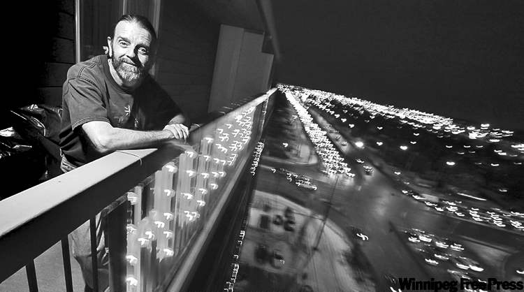 Don Guzda, keeper of the HUMBUG sign. (Phil Hossack / Winnipeg Free Press)