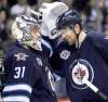 Winnipeg Jets' goaltender Ondrej Pavelec (31) and Blake Wheeler (26) celebrate after the teams victory over the Montreal Canadiens' at MTS Centre, December 22, 2011. (TREVOR HAGAN/WINNIPEG FREE PRESS)