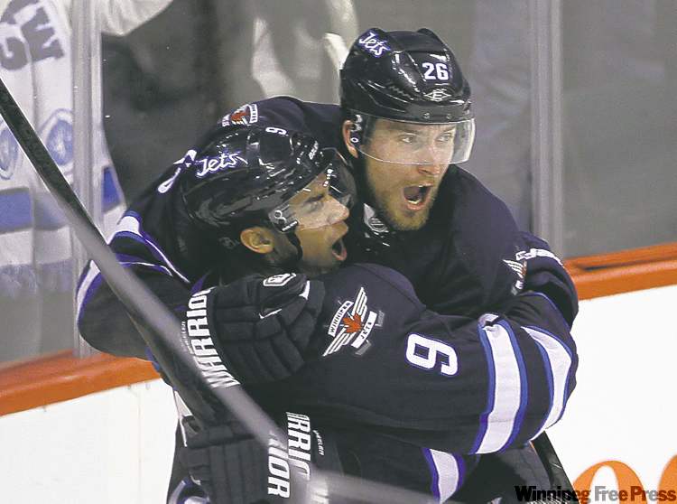 TREVOR HAGAN / WINNIPEG FREE PRESS
Blake Wheeler (right) was traded from Boston to Atlanta and then relocated to Winnipeg in 2011.