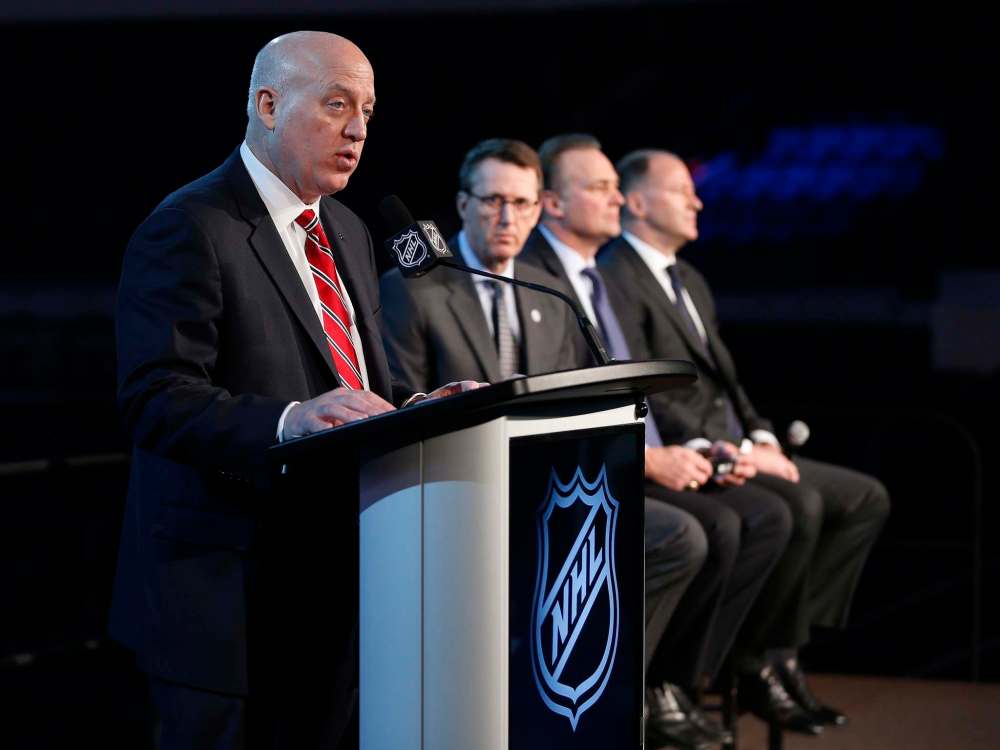 JOHN WOODS / THE CANADIAN PRESS
NHL Deputy Commissioner Bill Daly announces the Heritage Classic between the Winnipeg Jets and the Edmonton Oilers to be played Oct. 23 in Winnipeg. Jets Chairman Mark Chipman, Hockey Hall of Fame member Dale Hawerchuk and Oilers Entertainment Group Vice-Chairman Kevin Lowe were also in attendance.