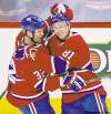 Dave Sidaway / postmedia news
Lars Eller (right) is congratulated by teammate Travis Moen after scoring the first of his four goals Wednesday.