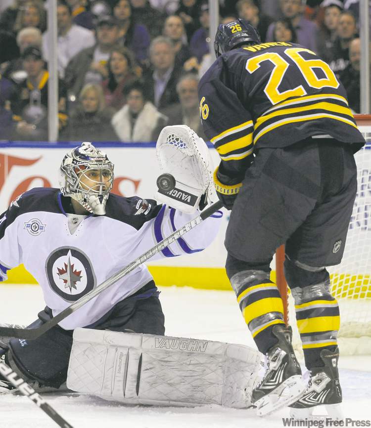 CP
Jets� goalie Ondrej Pavelec snares the puck before Buffalo Sabres� Thomas Vanek can pounce. Pavelec stopped 31 of 32 shots Saturday night.