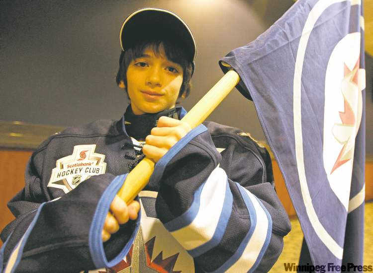 photos by TREVOR HAGAN / WINNIPEG FREE PRESS
'Cool. Awesome. Spectacular': Ashton Olin's description of being a flag-waver at a recent Winnipeg Jets game. The nine-year-old North Flyers player skated around the MTS Centre ice alongside his Jets heroes.