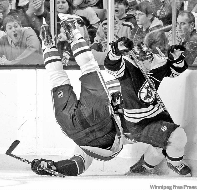 CP
Michael Dwyer / the associated press
Boston�s Brad Marchand (right) went low to upend Vancouver�s Sami Salo on Saturday.