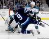 TREVOR HAGAN / WINNIPEG FREE PRESS
Winnipeg Jets winger Evander Kane is given a rough ride by San Jose�s Douglas Murray in front of the Sharks� goal during second-period action.