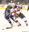 Jets' Johnny Oduya tries to keep  Devils' Dainius Zubrus off the disc in the contest Saturday.
