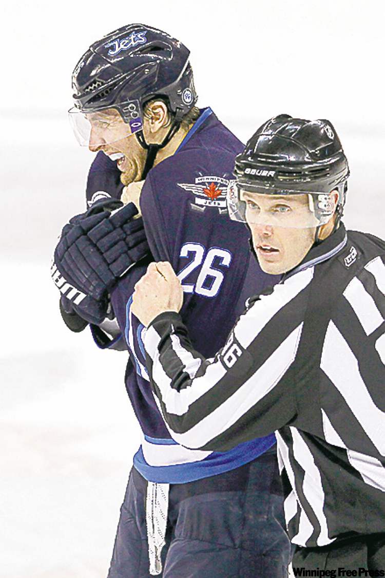 john woods / the canadian press
Blake Wheeler took a puck to the throat in Saturdays loss to New Jersey.