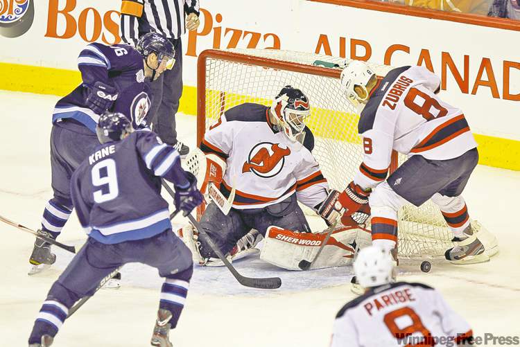 ruth bonneville / winnipeg free press
Devils goalie Martin Brodeur was able to fend off a frantic Jets attack late in the third when the Jets� net was empty and an extra attacker was on the ice.
