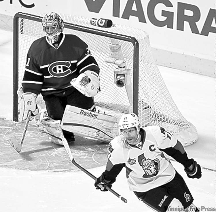 dave sidaway / postmedia news
Sens captain Daniel Alfredsson scores the shootout winner on Carey Price.
