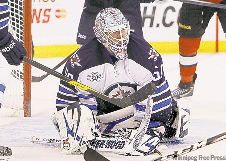 Postmedia Ottawa Citizen
OTTAWA, ON: JANUARY 16, 2012 -- Chris Mason of the Winnipeg Jets makes the save against the Ottawa Senators during third period of NHL action in Ottawa, January 16, 2012. (Photo Jean Levac, Ottawa Citizen) For Ottawa Citizen story by , SPORTS Assignment 107279