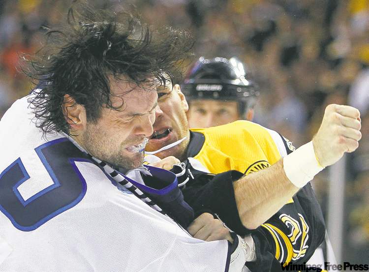 MICHAEL DWYER / THE ASSOCIATED PRESS ARCHIVES
Mark Stuart has the respect of his teammates whether he’s taking off the gloves, blocking shots or providing locker-room leadership.