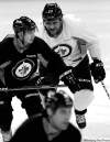 JOE BRYKSA / WINNIPEG FREE PRESS ARCHIVES
Jets blue-liner Dustin Byfuglien (rear) misses the dressing-room fun.
