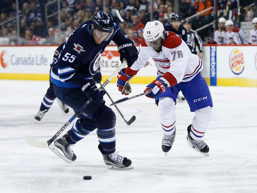 John Woods/ The Canadian Press
Jets centre Mark Scheifele undresses Montreal Canadiens defenceman P.K. Subban before scoring one of three goals Saturday.