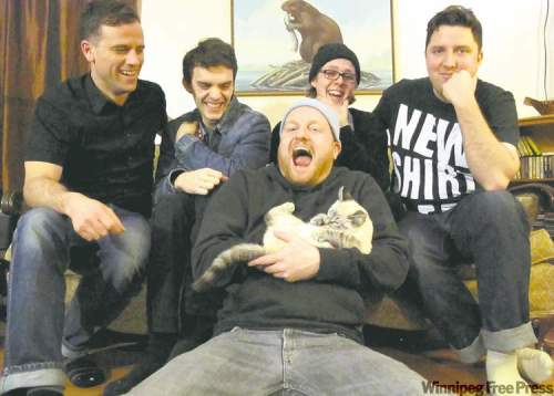 Must love cats: Pip Skid, centre, shows his soft side.